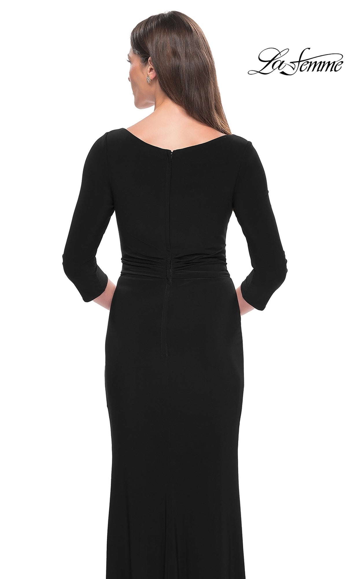 A woman faces away from the camera in the La Femme Sleeved Simple Jersey Formal Dress 30967, a long-sleeved, floor-length gown with a fitted waist. The La Femme logo is displayed in the top right corner.